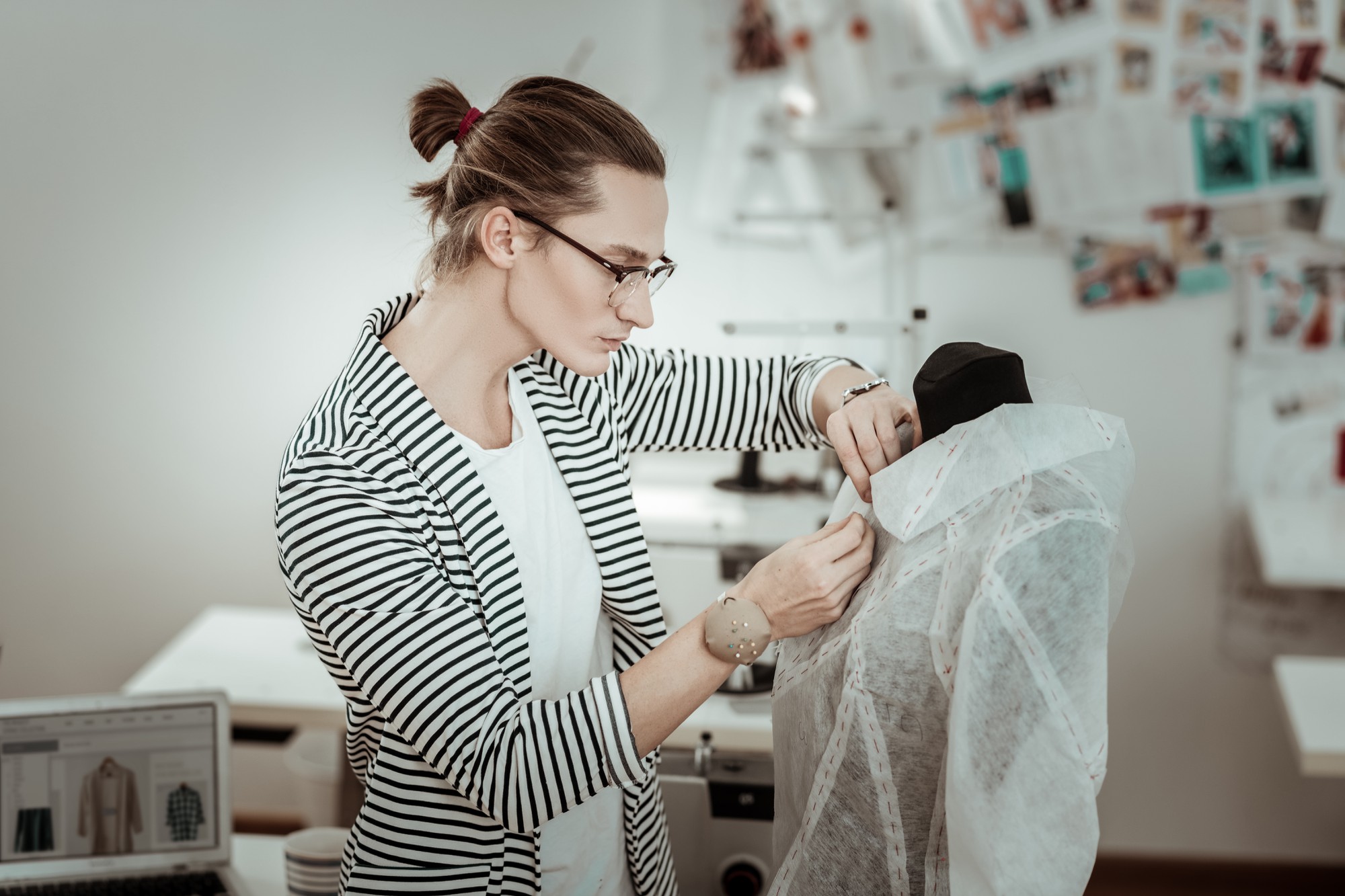 Team member photographing embroidery sample