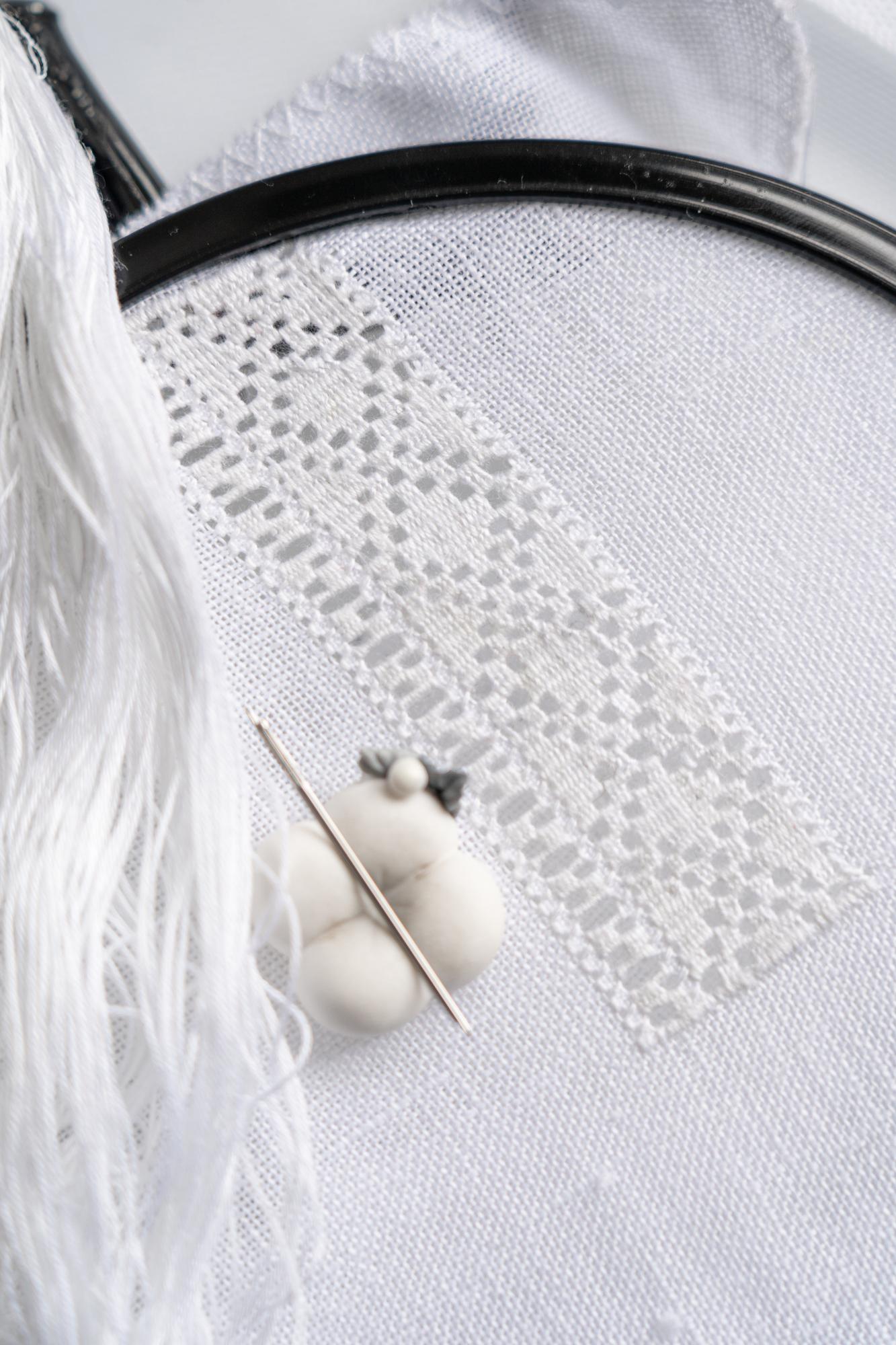 Limited edition embroidered patch on linen