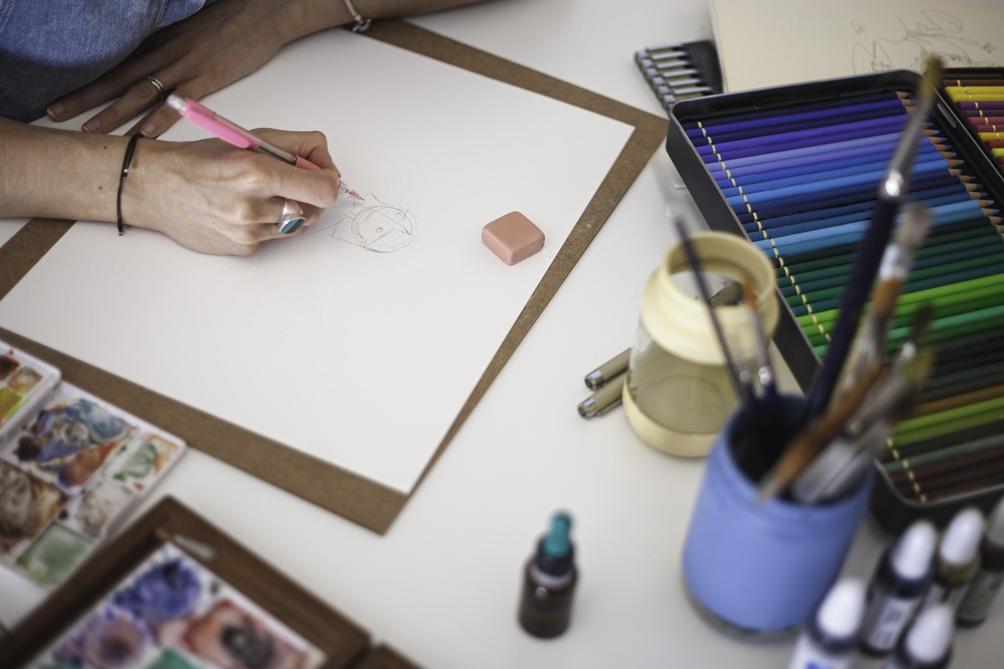 Studio sample board with thread swatches and sketches