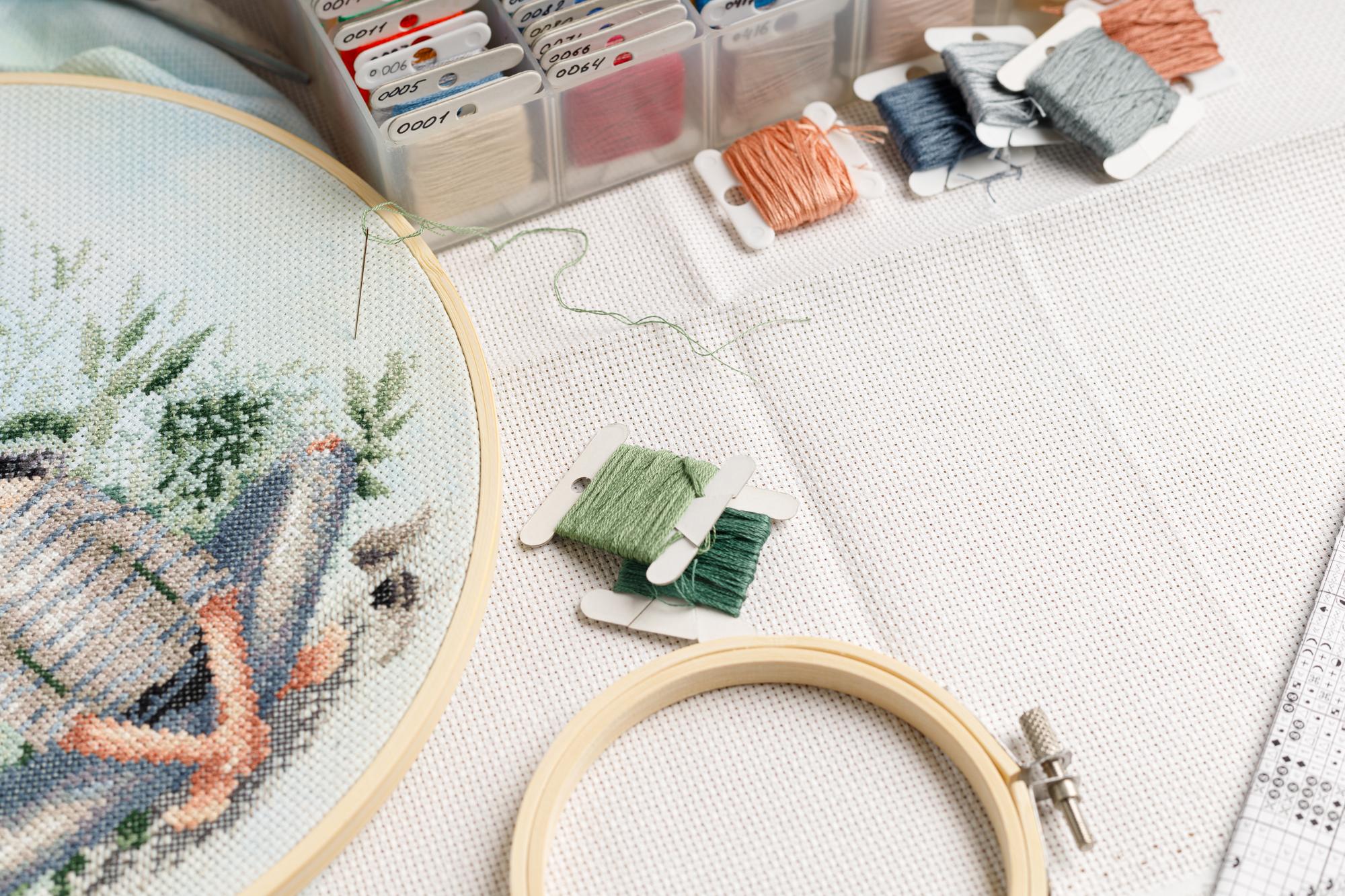 Close-up modern embroidery on fabric with geometric motif